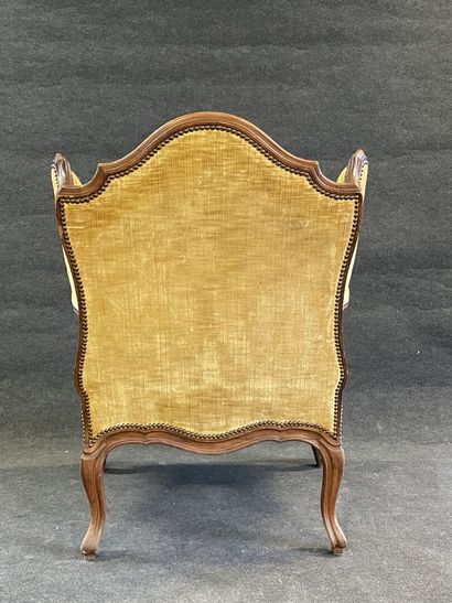 Armchair with ears in carved wood.
Louis...