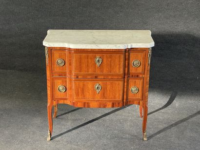 Inlaid chest of drawers, with central projection,...