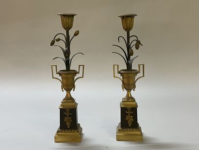 Pair of candlesticks in gilded and patinated...