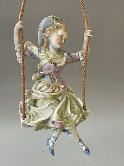 Jeune fille sur une balançoire
Statuette...