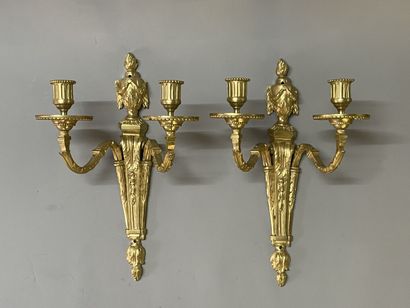 Pair of bronze sconces with two lights.
Louis...