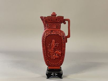 Carved lacquer jug on a wooden base. 
H....
