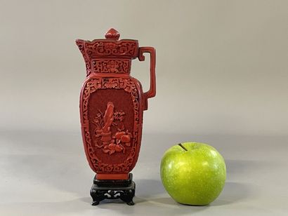 Carved lacquer jug on a wooden base. 
H....