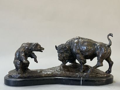 Bison facing a bear. 
Modern sculpture in...
