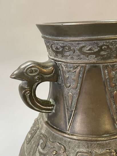 Bronze vase with stylized decoration. Mark...