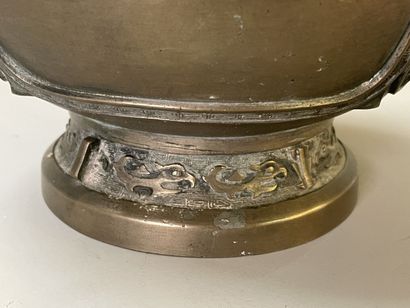 Bronze vase with stylized decoration. Mark...