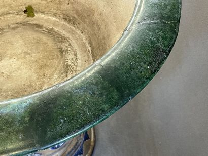 Large ceramic basin of round form, resting...