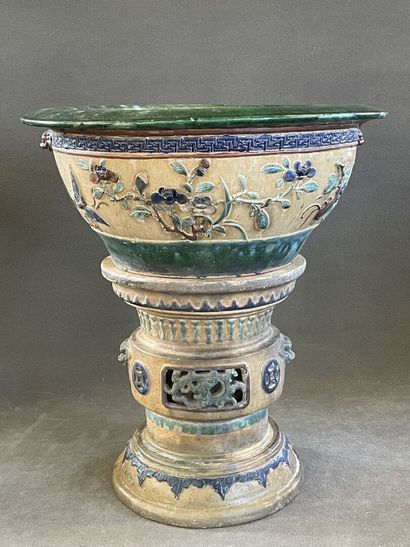 Large ceramic basin of round form, resting...