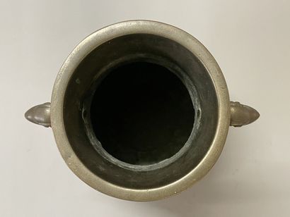 Bronze vase with stylized decoration. Mark...