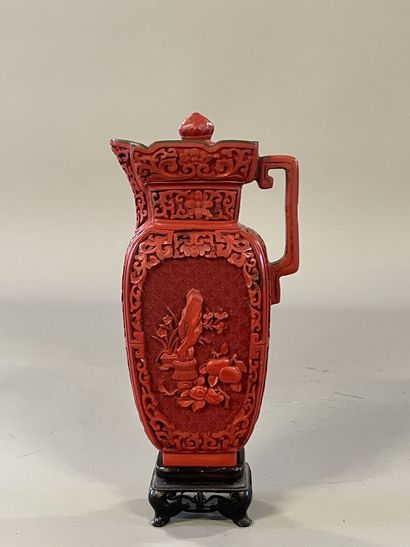 Carved lacquer jug on a wooden base. 
H....
