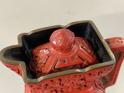 Carved lacquer jug on a wooden base. 
H....