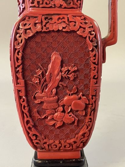 Carved lacquer jug on a wooden base. 
H....