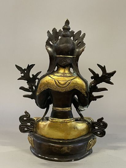Buddha in gilded and patinated bronze. 
Tibet...