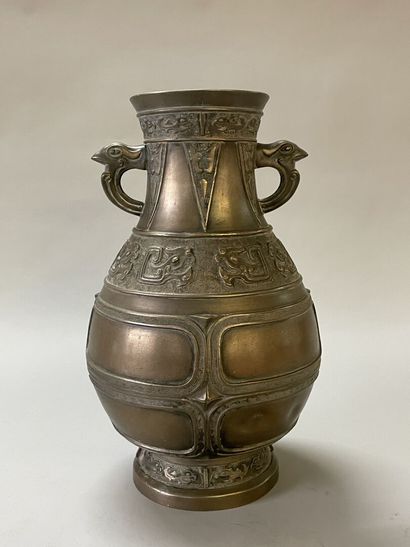 Bronze vase with stylized decoration. Mark...