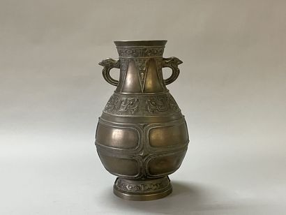 Bronze vase with stylized decoration. Mark...