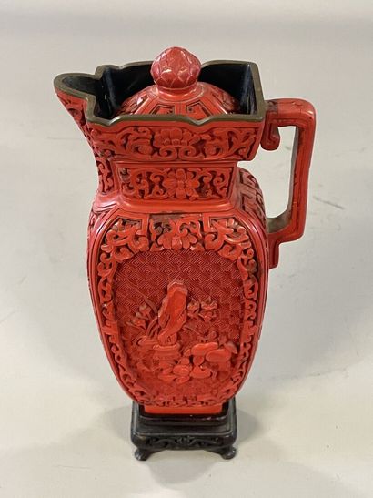 Carved lacquer jug on a wooden base. 
H....