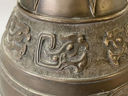 Bronze vase with stylized decoration. Mark...