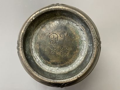 Bronze vase with stylized decoration. Mark...