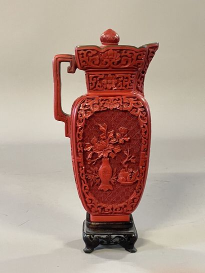 Carved lacquer jug on a wooden base. 
H....