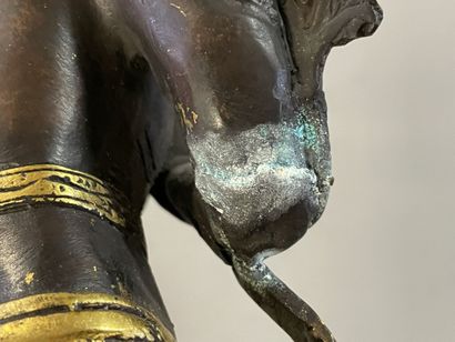 Buddha in gilded and patinated bronze. 
Tibet...