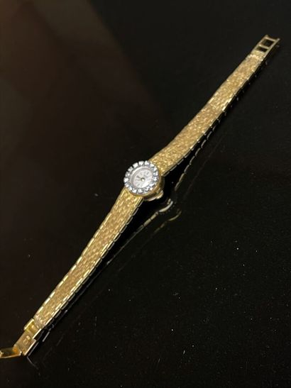 Montre en or et diamants.
Or 750°/00.
L:...