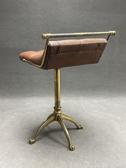 Swivel desk chair in tan leather and bronze...