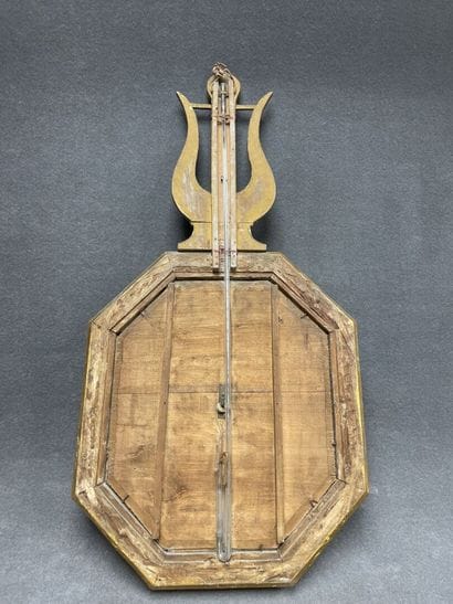 Barometer in carved wood and stucco, golden...