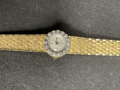 Montre en or et diamants.
Or 750°/00.
L:...