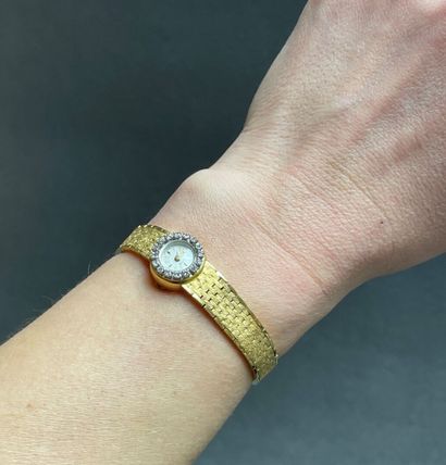 Montre en or et diamants.
Or 750°/00.
L:...