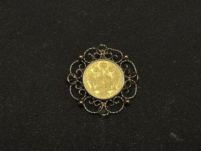 Broche en or sertie d'une pièce autrichienne.
Or...