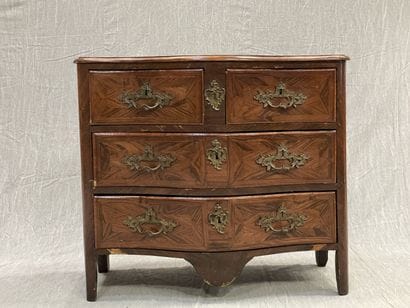 Chest of drawers in rosewood, opening with...
