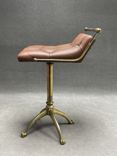 Swivel desk chair in tan leather and bronze...