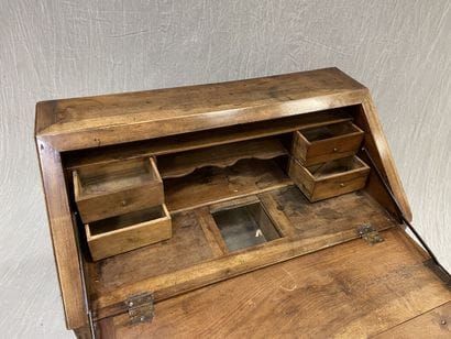 Scriban desk in walnut, opening to four drawers...