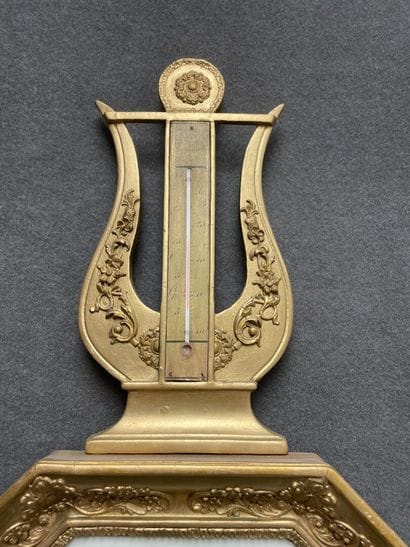 Barometer in carved wood and stucco, golden...
