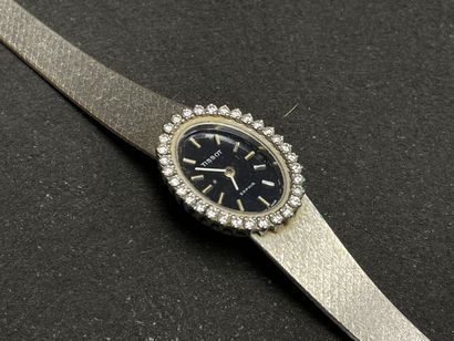 TISSOT Montre bracelet de dame en or gris,...