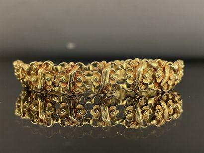 * Cuff bracelet with gold flowers 
Gold 750°/00
L:...