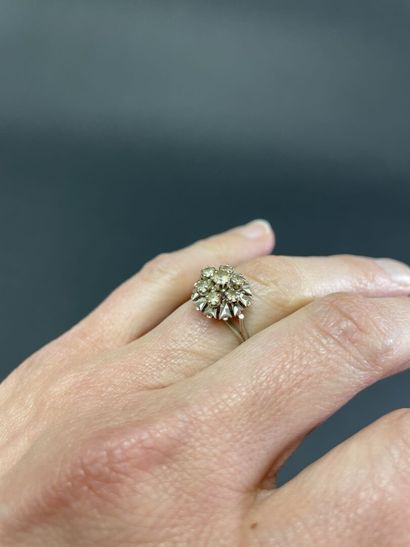 Daisy ring in white gold set with white stones.
Gold...