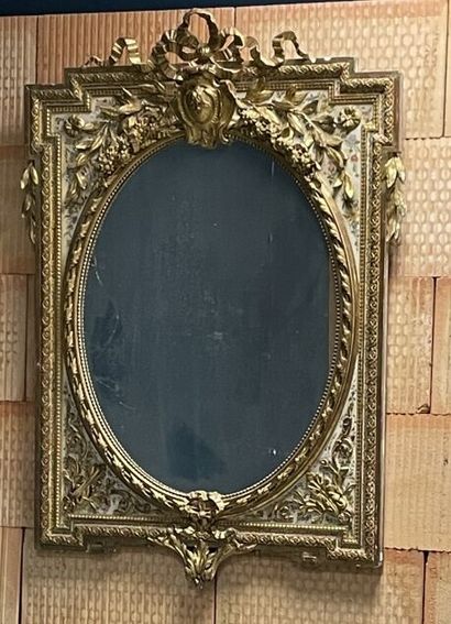 Wood and stucco mirror gilded and lacquered...