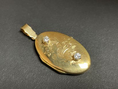 Gold pendant souvenir, set with two small...