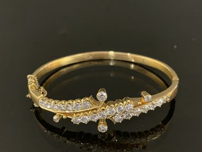 Gold bracelet set with lines of scrolling...