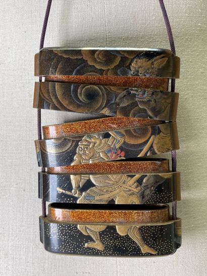 Lacquered wood inro with four squares decorated...