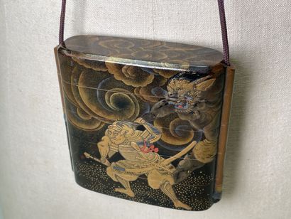 Lacquered wood inro with four squares decorated...
