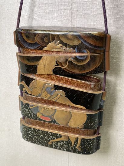 Lacquered wood inro with four squares decorated...