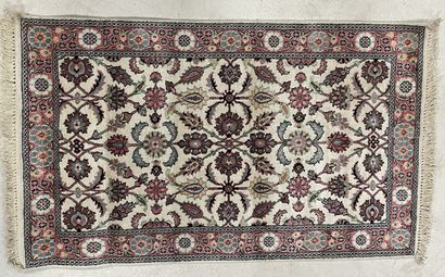 Silk carpet decorated with pink flowers on...