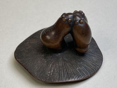 Carved wood netsuke with a mushroom.
Japan...