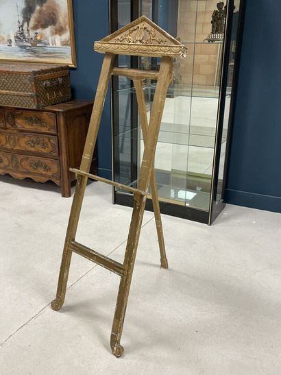 Wood and gilded stucco easel with a pediment...