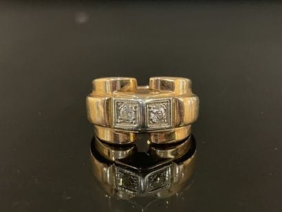 Gold tank ring set with two diamonds.
Weight:...