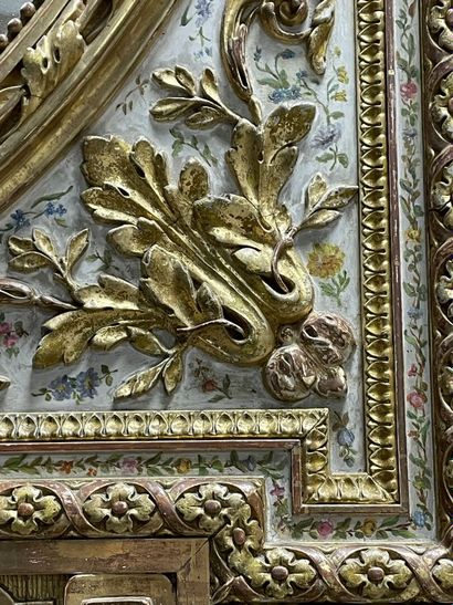 Wood and stucco mirror gilded and lacquered...