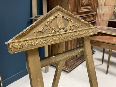 Wood and gilded stucco easel with a pediment...