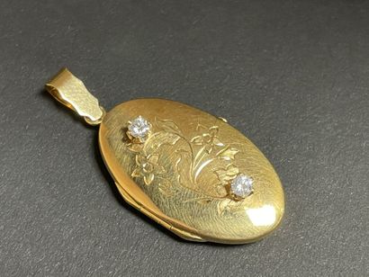 Gold pendant souvenir, set with two small...